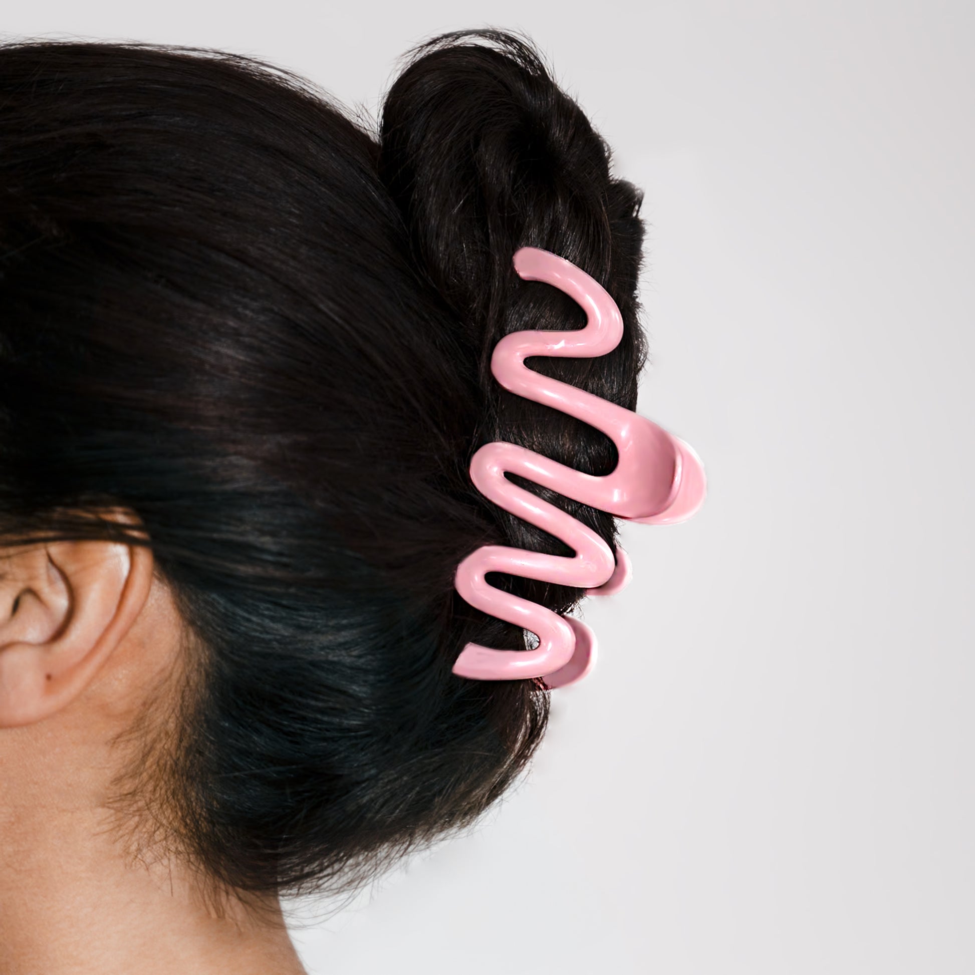 Pink Zigzag Wavy Claw Hair Clip shown worn the model's hair