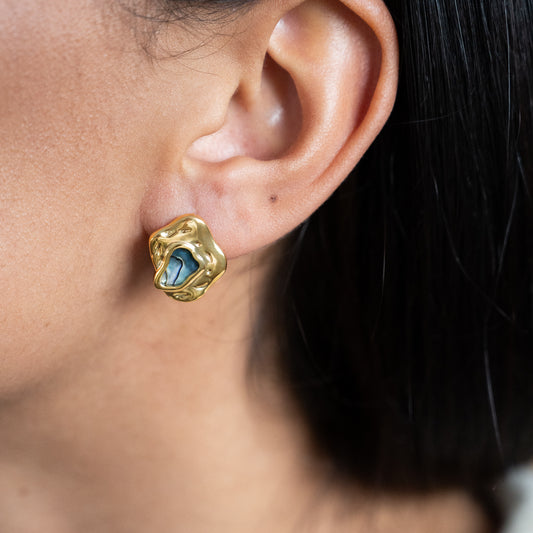 Iridescent Abalone In Molten Metal Stud Earrings shown worn in a model's ear