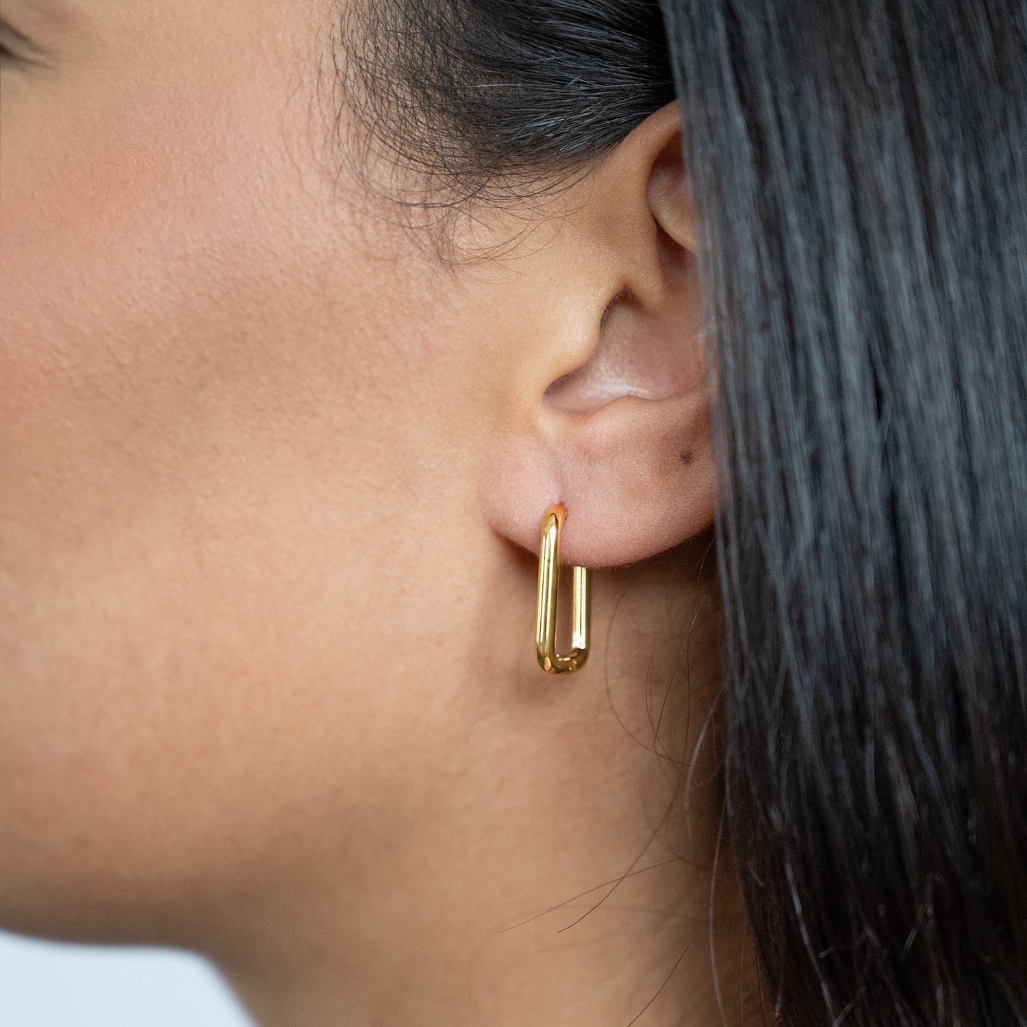 Rectangular Hoop Earrings Non Tarnish shown worn in a model's ear