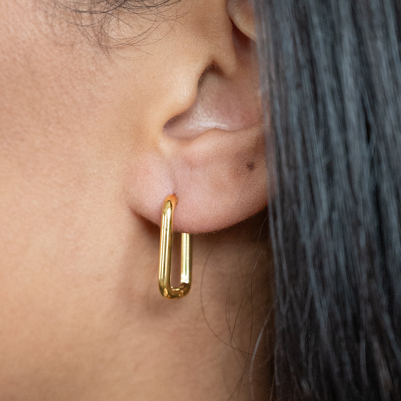 Rectangular Hoop Earrings Non Tarnish shown worn in a model's ear