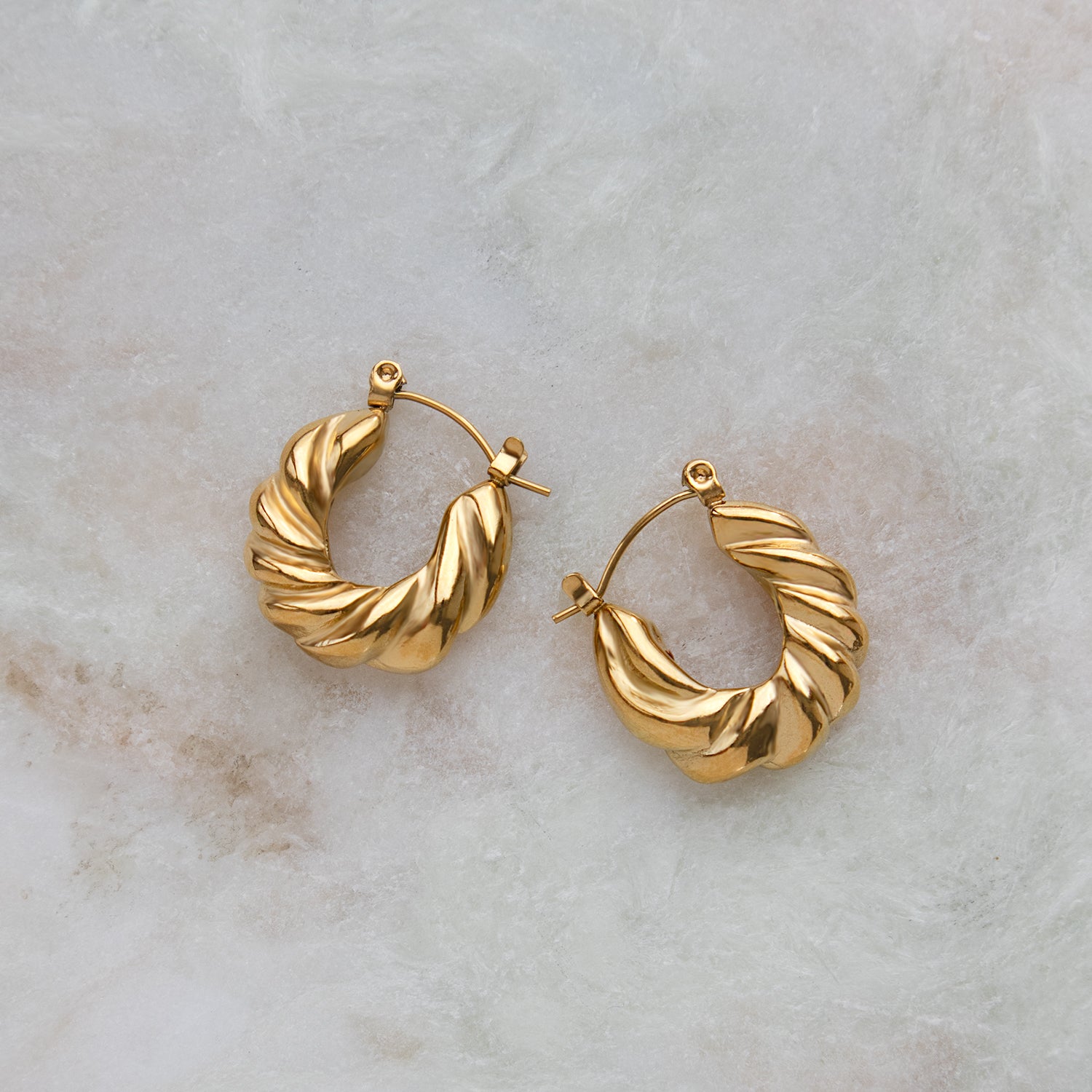 Close up view of Twisted Croissant Hoop Earrings
