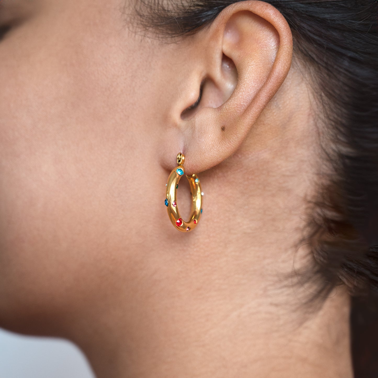 Dotted Colourful Gem Hoops Non Tarnish shown worn in a model's ear
