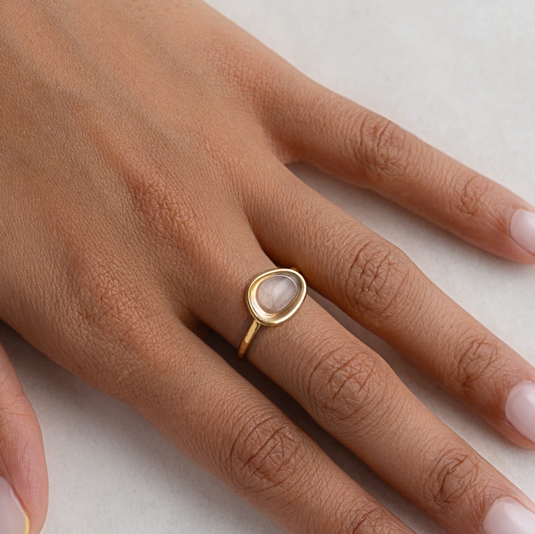 Irregular Clear Cabochon Ring shown worn on a model's finger