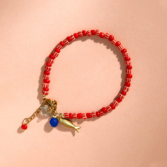 Red Candy Stripe Bead and Fish Charm Bracelet