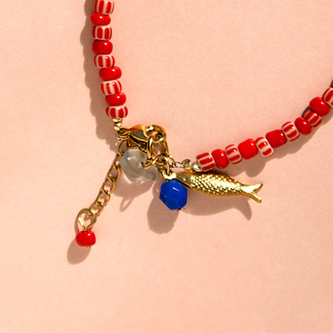 Red Candy Stripe Bead and Fish Charm Bracelet