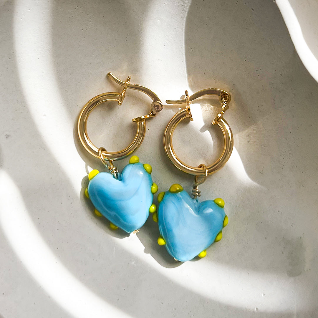 blue hearts and gold hoop earrings